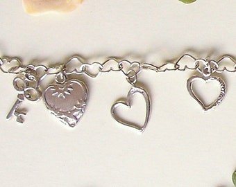 bracelet, hearts and keys, made of sterling silver, with charms of hearts and keys