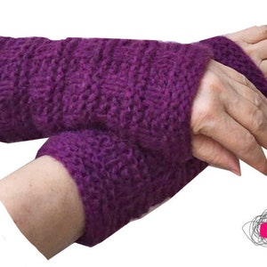 May include: Purple knitted fingerless gloves with a textured pattern. The gloves are shown on a person's hands.