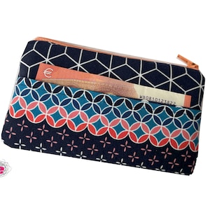 Funda para móvil con cremallera y compartimento extra