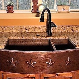 May include: A copper farmhouse sink with a hammered finish and four star accents. The sink has two basins and a black faucet.