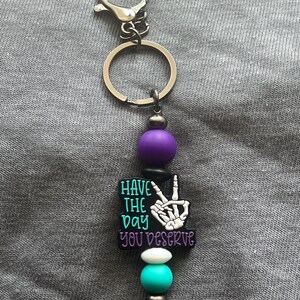 Have The Day You Deserve Keychain