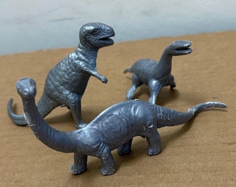 MPC Silver Dinosaur lot of 3 Vintage Plastic Toy Figures 1960's Prehistoric Tyrannosaurus Rex Brontosaurus Kronosaurus T-Rex Sea Monster