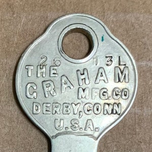 True Vintage Key Graham MFG Co unusual slanted engraving flat silver tone 2&quot; Derby Conn USA Wolfe Schen NY old Safe and Lock Company 1940&#39;s