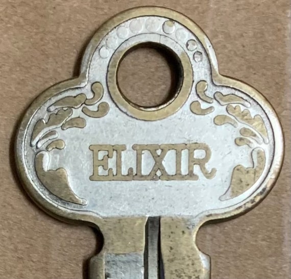Elixir Vintage Brass Key USA Ornate Flat True Old Silver Tone Plate Door  and Metals Co Industrial 1950's Waco Tx, Douglas GA, Tuscumbia AL 