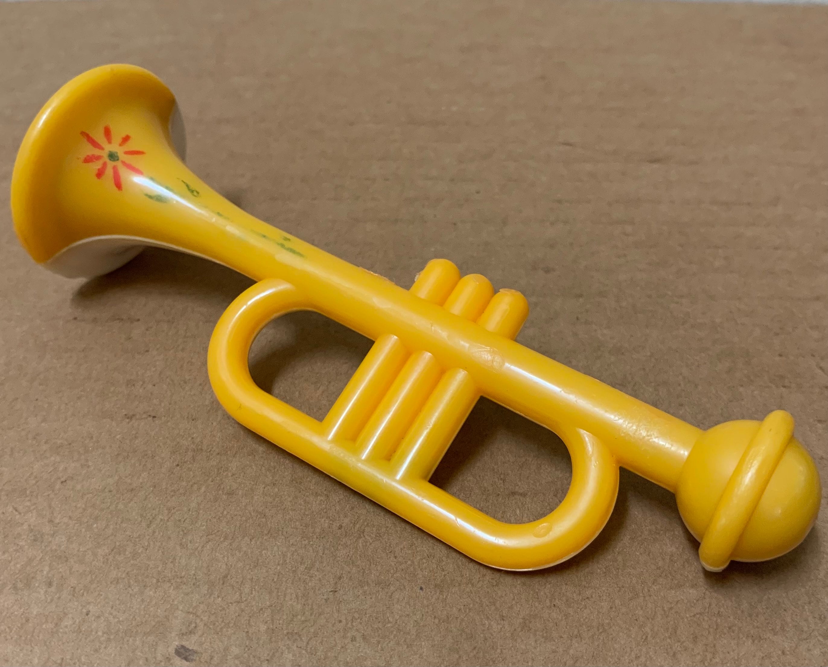 Yellow toy trumpet deals