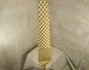 COACH Vintage Men's Tie. 100% Silk, Light Yellow W/Belts Pattern Made in the USA