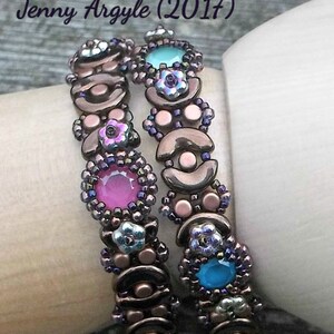 May include: Two beaded wrap bracelets. The bracelets feature a mix of copper-colored beads, pink, blue, and turquoise gemstones, and small floral accents. The text "Jenny Argyle (2017)" and "Wrap" are visible.