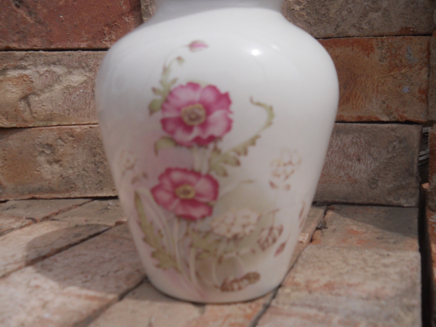 White Urn with Rose colored Flowers.Ceramic jar with lid,urn, Jar with