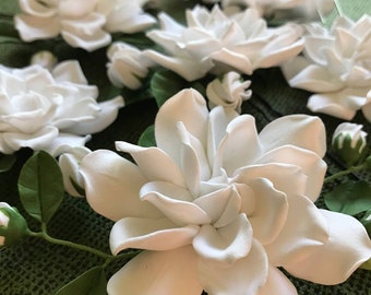 White gardenia flower pin with buds and leaves. Gardenia hairstyles for brides ,bridesmaids.