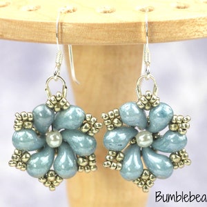 May include: A pair of silver dangle earrings with a blue and gold flower design. The flowers are made of small beads and have a pearl in the center.