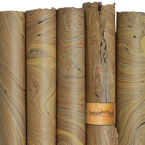May include: A collection of rolled paper with a marbled design in shades of brown, tan, and cream. The paper has a swirling pattern with hints of red, black, and blue. A band with the text "Sustain & Heal" wraps around the rolls.