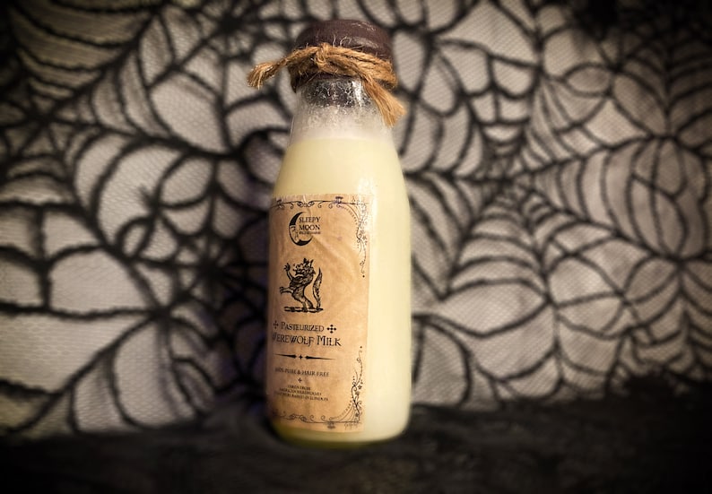 May include: A glass bottle with a brown cork top and a label that reads "Pasteurized Werewolf Milk". The bottle is filled with a pale yellow liquid and is sitting on a black and white patterned surface.