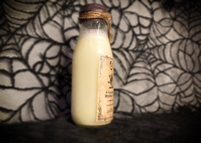 May include: A glass bottle with a white liquid inside and a brown label with a black and white illustration of a creature and text that reads "+ Potion of Wederwart". The bottle is sitting on a black and white patterned surface.