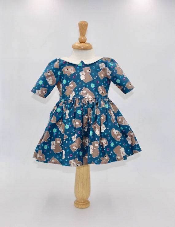 blue dress 12 18 months Size 12-18 months. Adorable teddy bears are sprinkled all over this dark teal 3/4-sleeve for a little girl. Ready to ship! English Factory Work Dresses size-3XL and layer with a Size:Us Size 2 light blue mini dress