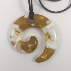 Golden yellow and creme in a journey shape fused glass pendant