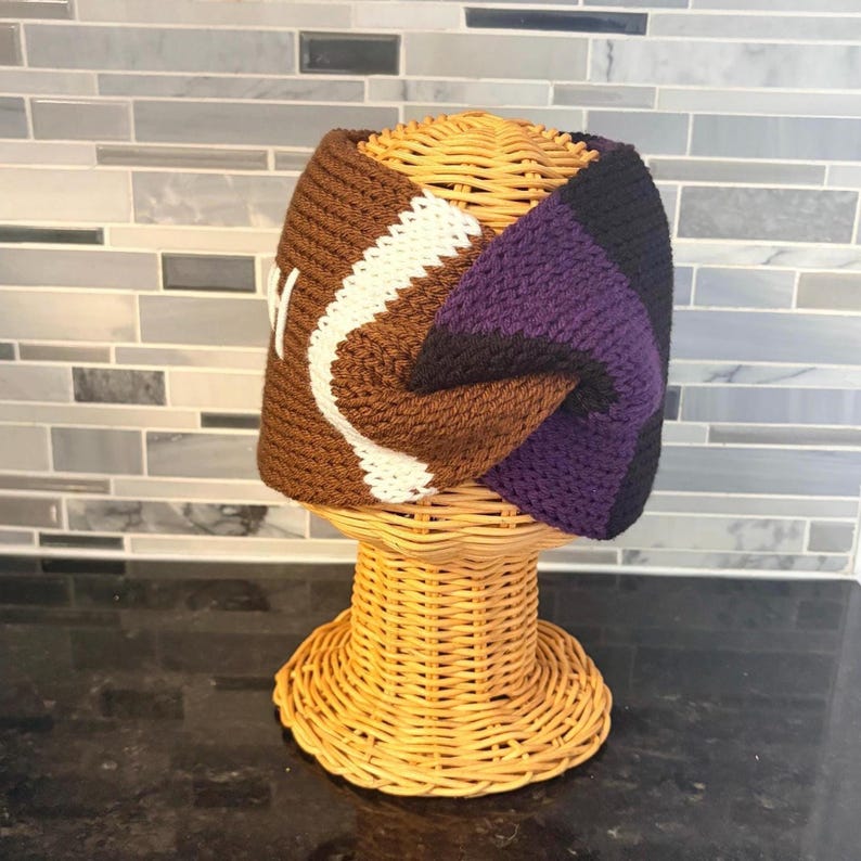 net twist headband with football design and black and purple stripes