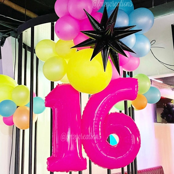 ballon géant chiffre 1 rose pour fêter un anniversaire fille