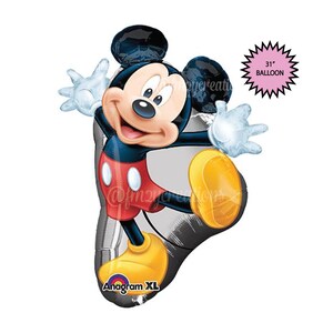 May include: A large 31-inch silver Mickey Mouse balloon with red shorts and yellow shoes. The balloon is made by Anagram and is part of their XL line.