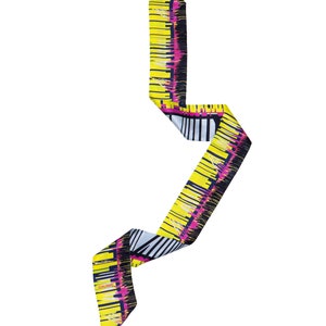 Printed skinny scarf in vibrant colors. Double sided narrow twill silk scarf with bias cut edges. Neon yellow, Pink, Black, Grey. Designer scarf by Dikla Levsky.