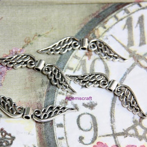 4 Silver tone filigree  52x11mm Angel Fairy Wings beads spacers Beading ornament sun catcher