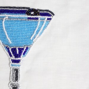 Transform your space into a tropical paradise with our beaded Blue Lagoon wall art. Crafted with blue, gray, and white beads, this stunning piece will add a touch of elegance to any room. Enjoy the intricate craftsmanship that will bring fun.