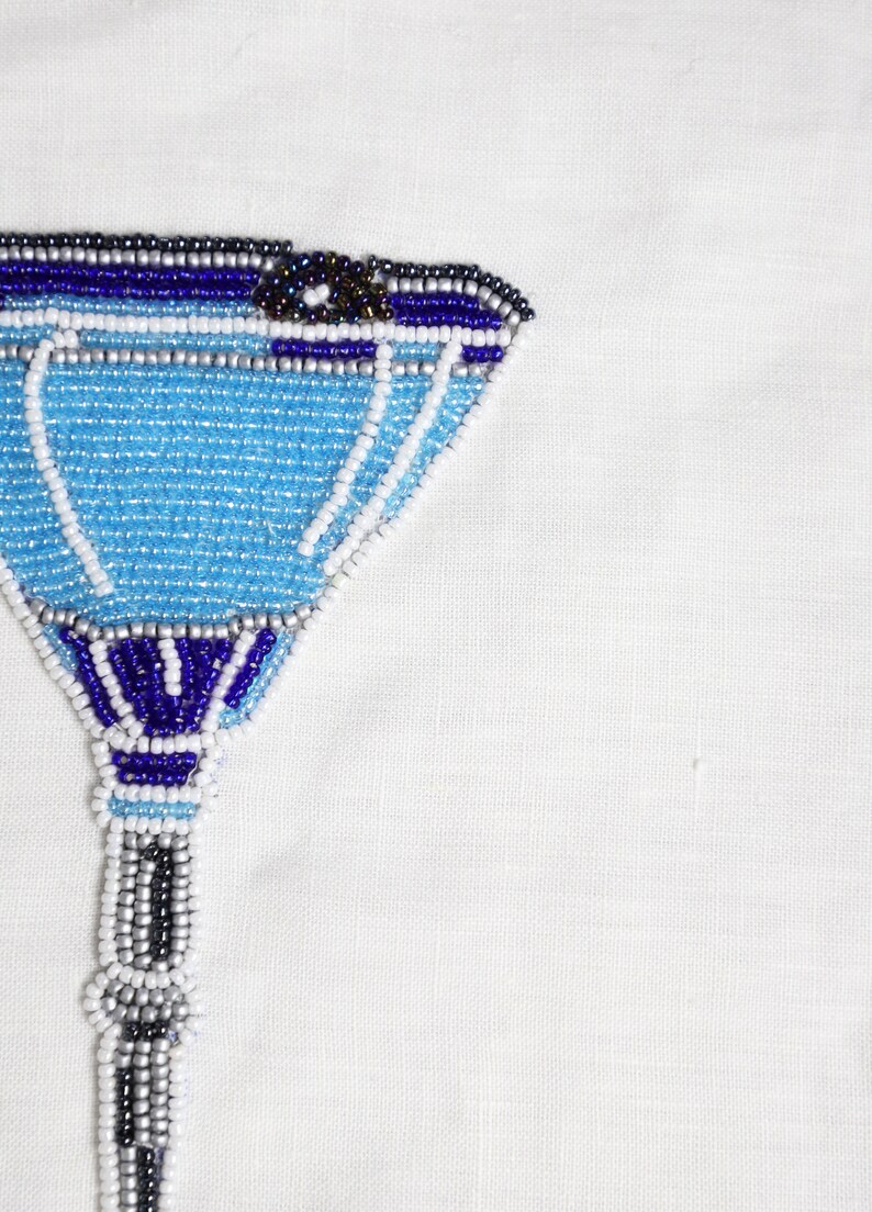 Transform your space into a tropical paradise with our beaded Blue Lagoon wall art. Crafted with blue, gray, and white beads, this stunning piece will add a touch of elegance to any room. Enjoy the intricate craftsmanship that will bring fun.