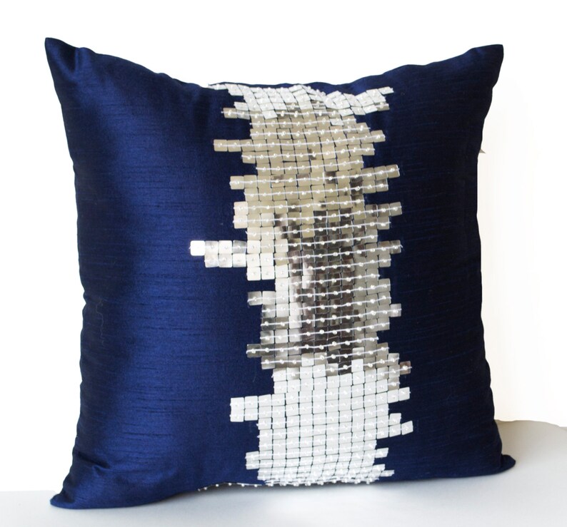 silver and blue pillows