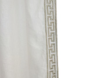 May include: White sheer curtain panel with a silver Greek key design border.