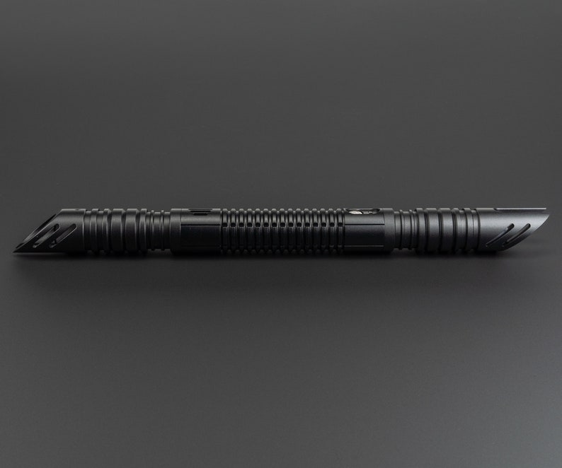 May include: A black lightsaber with a textured grip and a silver accent. The lightsaber is a popular prop for cosplay and fantasy enthusiasts.