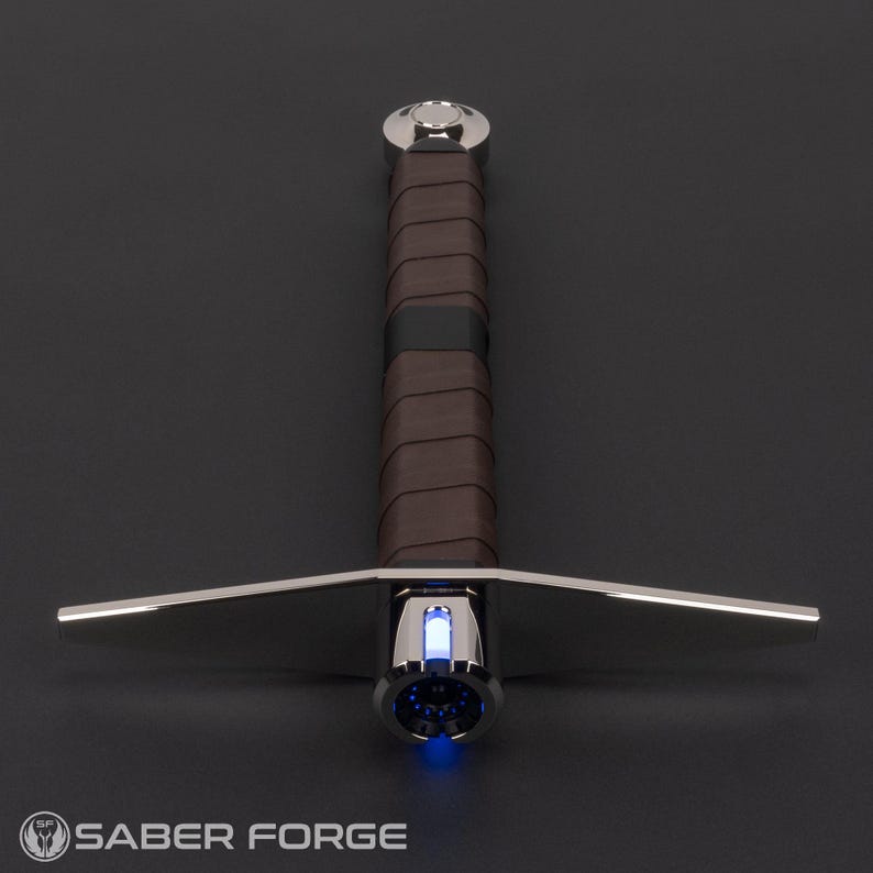 May include: A silver-toned metal hilt with a brown leather-wrapped grip and a crossguard. The hilt features a glowing blue light at the emitter and a polished pommel at the base. The Saber Forge logo is visible in the bottom left corner.