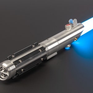 May include: A silver lightsaber with a bright blue blade extending from the top. The hilt is metallic with black accents and a red button. The lightsaber is a prop or toy, likely for cosplay or display.