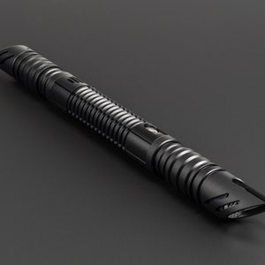 May include: A black lightsaber with a textured grip and a pointed tip.
