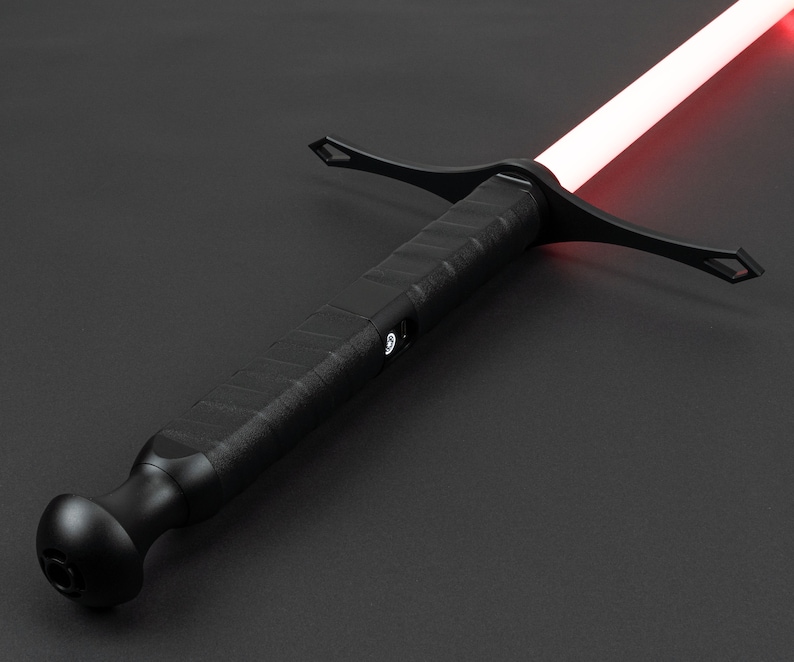 May include: A black lightsaber with a red blade and a textured handle. The lightsaber has a crossguard and a round pommel.