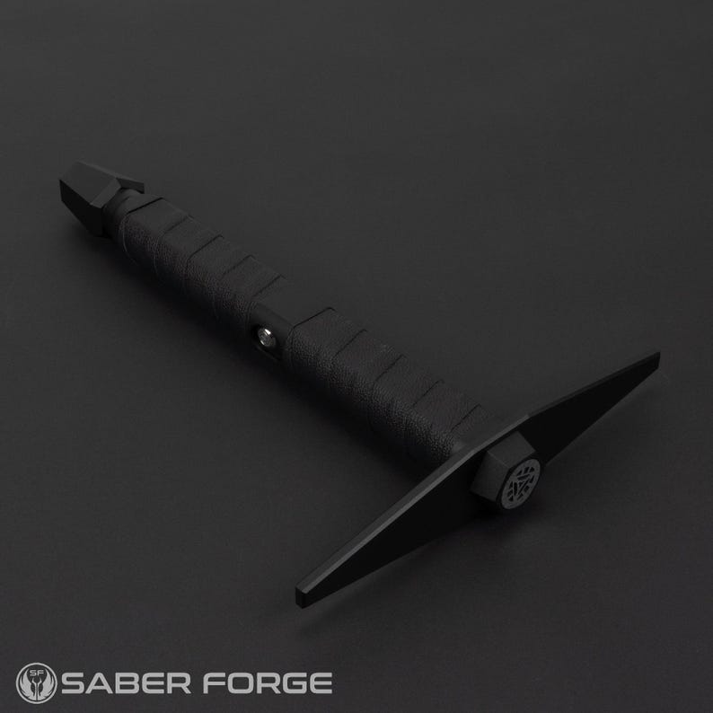 May include: A black,  metal,  hand-held tool with a  sharp,  pointed tip and a  flat,  wide blade. The tool has a  textured,  black handle.