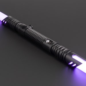 May include: A black lightsaber with a purple blade. The lightsaber has a textured grip and a silver button.