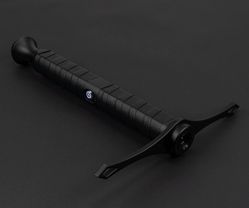 May include: A black handheld inspection camera with a flexible, extendable arm. The camera has a small, round lens and a textured grip.