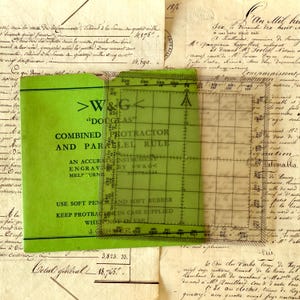May include: A vintage green "Douglas" combined protractor and parallel rule, with text, on a background of aged paper documents. The protractor is transparent with grid lines and measurement markings. The text includes "An Accurate Instrument" and "Melbourne".