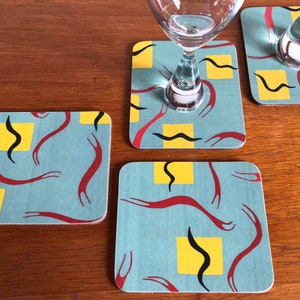 Teal print laminated set of four cork coasters