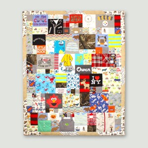 May include: A patchwork quilt made from baby clothes in various colours and patterns. The quilt features a variety of designs, including animals, vehicles, and text. The text includes "I'm the cool little brother", "Born to Ride", "Little Rock", "Dare Devil", "Owen", and "I love NY".