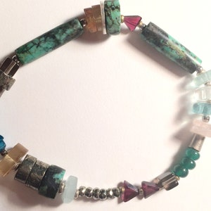 A soft balance of shimmering jewels /& tribal charms The BANKS Jeweled Bracelet: emeralds yet modern and colorful bohemian turquoise