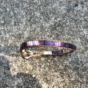 Skinny Flat Bead Wampum Bracelet on a False Sinew Braid. Available on black sinew or natural colored sinew.