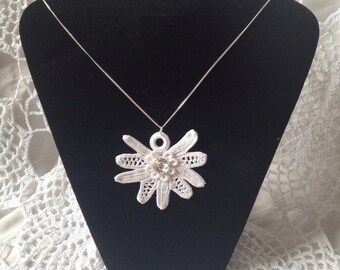 Irish lace pendant on a silver chain