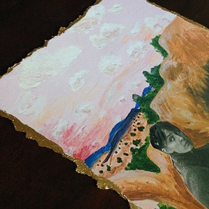 May include: A mixed media painting on paper with a pink and orange sky, white clouds, and a green and brown landscape. A black and white photograph of a person is partially visible in the lower right corner.