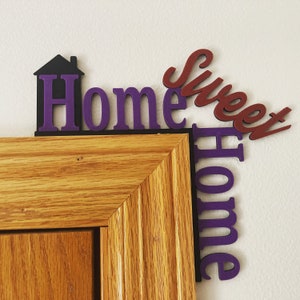 door decor with home in purple and sweet in red with the house in black.