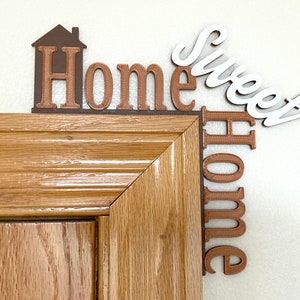 Closeup on door frame of Home Sweet Home door corner decor.