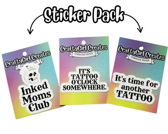 May include: A sticker pack featuring three stickers with tattoo-themed designs. One sticker reads "Inked Moms Club" with a skull graphic. Another says "It's Tattoo O'Clock Somewhere." The third sticker reads "It's time for another Tattoo."