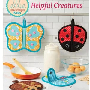 May include: Four colorful pot holders with animal and insect designs. The pot holders are hanging on a rack in a kitchen setting. The pot holders are labeled A, B, C, and D. The pot holders are made by Ellie Mae Designs and the pattern number is K269. The text "Helpful Creatures" is displayed above the pot holders.