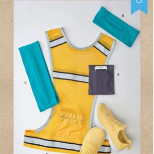 May include: A yellow running vest with reflective strips, a blue headband, a blue armband, a gray pocket, and the text "Kwik Sew K4360" and "ARMBAND, HEADBAND, BELT AND VEST".
