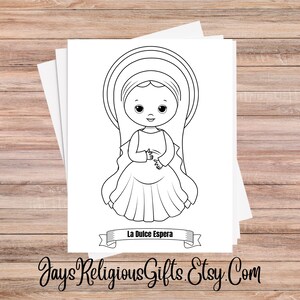May include: Black and white line drawing of a cartoon figure of a girl with a halo, wearing a dress. The text "La Dulce Espera" is on a banner below the figure. The Etsy shop name "JaysReligiousGifts.Etsy.Com" is at the bottom.