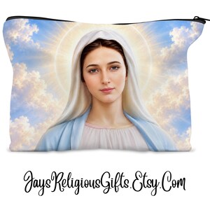 May include: A rectangular zippered pouch featuring a printed image of the Virgin Mary wearing a white head covering and a light blue garment against a background of blue sky, white clouds, and a glowing halo. The text JaysReligiousGifts.Etsy.Com is below.